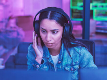Developer, computer or headphones in neon coding for cybersecurity iot, night SEO thinking or code .